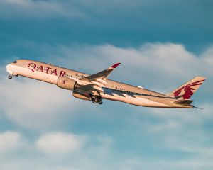 Qatar airlines plane taking off in sky